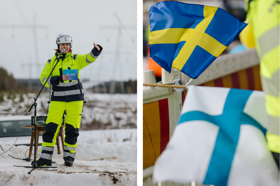 Ida står på en scen av snö och håller tal, svenska och finska flaggor